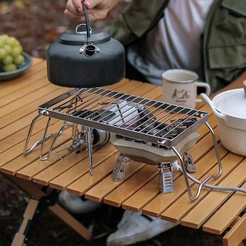 man-cooking-on-rectangular-grill-stand