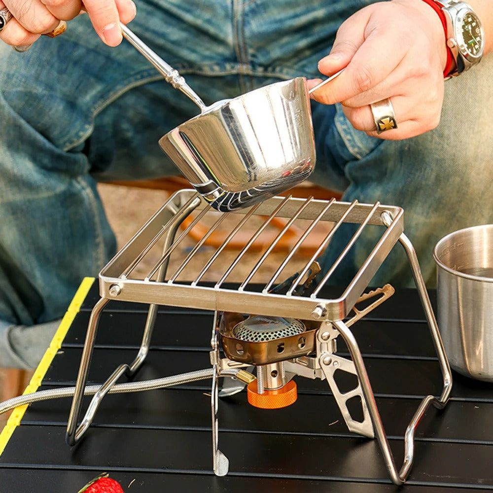 man-cooking-on-square-grill-stand